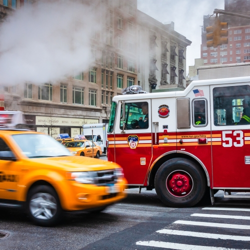 Fire engine and taxi passing on 3rd Avenue, New York City NY029