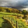 Fields and stone barn alongside the River Wharfe near Kettlewell, Wharfedale, Yorkshire Dales, England.