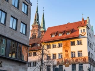 Nuremberg Chamber of Commerce building with 'Merchants' Caravan' mural, Germany. N006