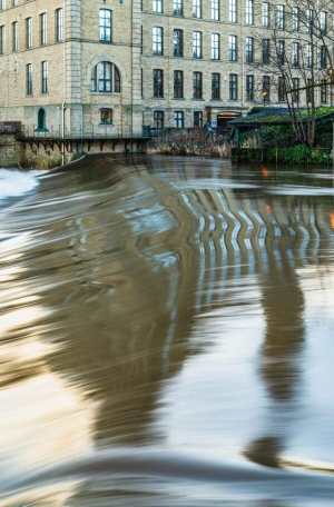 Salts Mill and the River Aire, Bradford, West Yorkshire, England Salts Mill and the River Aire, Bradford, West Yorkshire, England