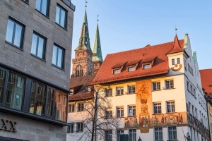 Nuremberg Chamber of Commerce building with 'Merchants' Caravan' mural, Germany. N006