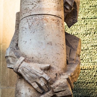 Josep Maria Subirachs sculpture of Jesus Christ at the base of Passion Facade of La Sagra Familia basilica.