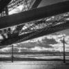 The three Forth Bridges from underneath the Rail Bridge, North Queensferry, Scotland.
