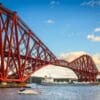 The 'Solero' sailing under the Forth Rail Bridge Scotland, United Kingdom. FB002