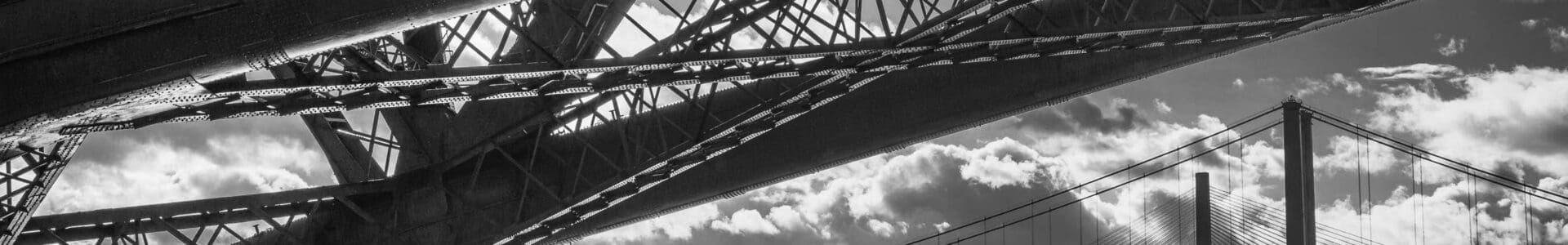 The three Forth Bridges from underneath the Rail Bridge, North Queensferry, Scotland.