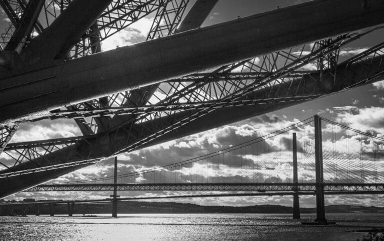 The three Forth Bridges from underneath the Rail Bridge, North Queensferry, Scotland.