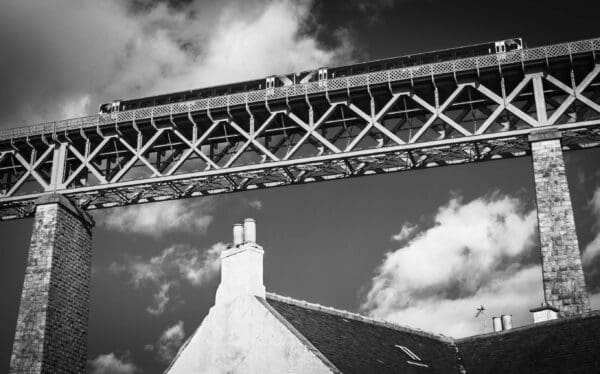 Train passing over the Forth Rail Bridge above North Queensferry, Fife.