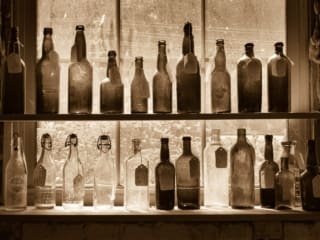 Shelves of antique glass bottles in a vintage store in the River Arts District, Asheville, North Carolina, USA. NC010