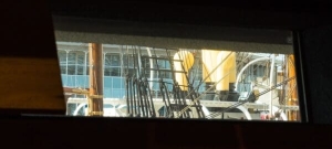 View of the RRS Discovery through a rectangular window of the V&amp;A building in Dundee, Scotland. DD182
