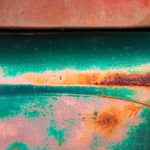 Corroded painted surface of a truck in Spruce Pine, North Carolina, USA. NC017