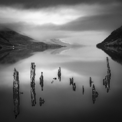 Rotting old pier supports at the head of Loch Arkaig, Lochaber, Scotland.