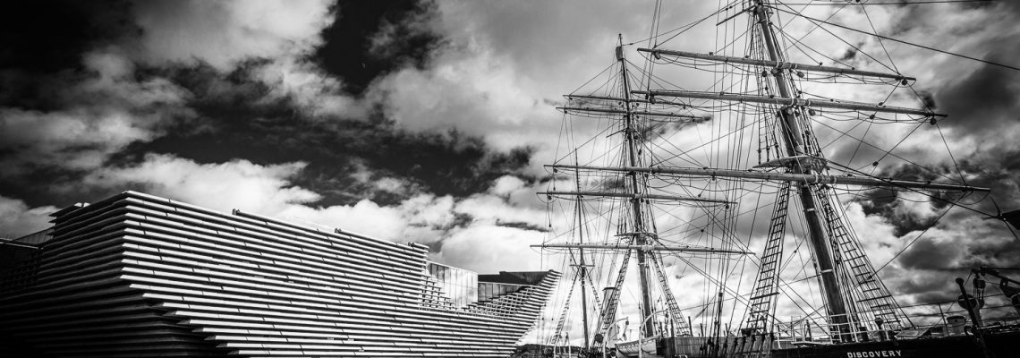 Monochrome (black and white) image of RRS Discovery and the V&A Dundee, Dundee, Scotland. DD023
