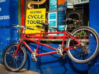 Tandem secured outside cycle tour office in Edinburgh, Scotland. EH013