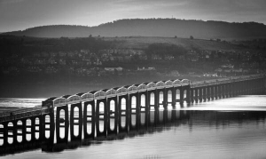 Monochrome image of the Tay Rail Bridge from Dundee, Scotland. DD038