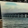 The central arches of the Tay Rail Bridge framed by pillars at the Dundee end, Scotland. DD081