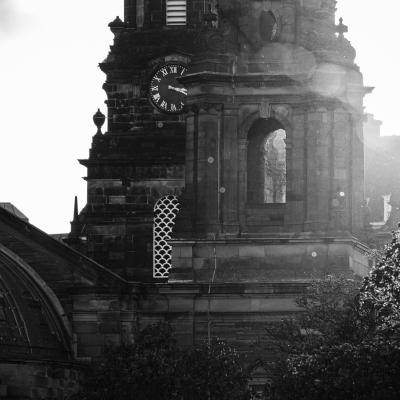 Monochrome (black and white) image of St Cuthbert's Parish Church at the west end of Princes Street Gardens, Edinburgh, Scotland, United Kingdom.