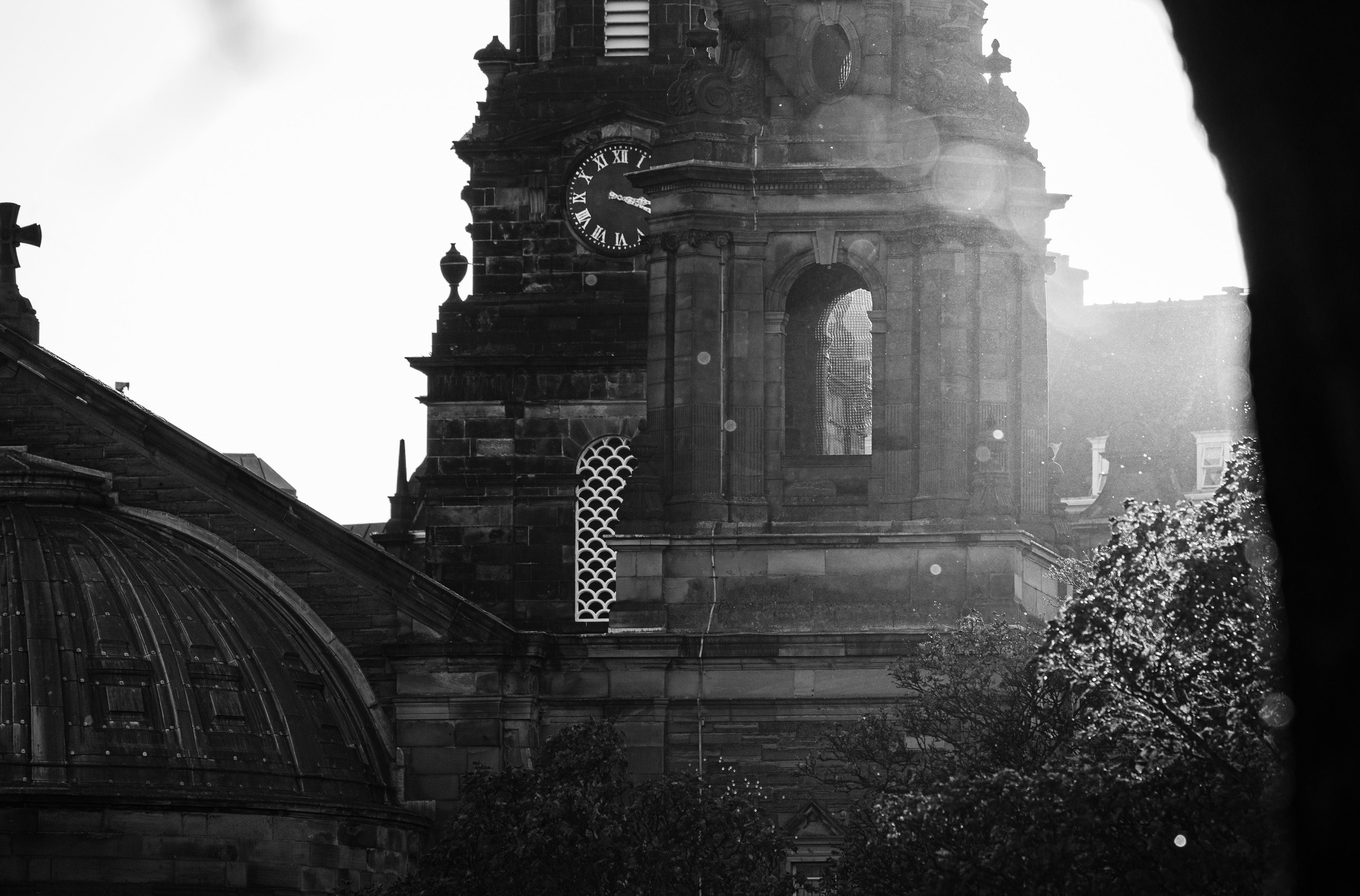 Monochrome (black and white) image of St Cuthbert's Parish Church at the west end of Princes Street Gardens, Edinburgh, Scotland, United Kingdom.