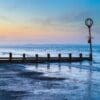 Groyne and marker post at Portobello beach, Edinburgh, Scotland. EH035