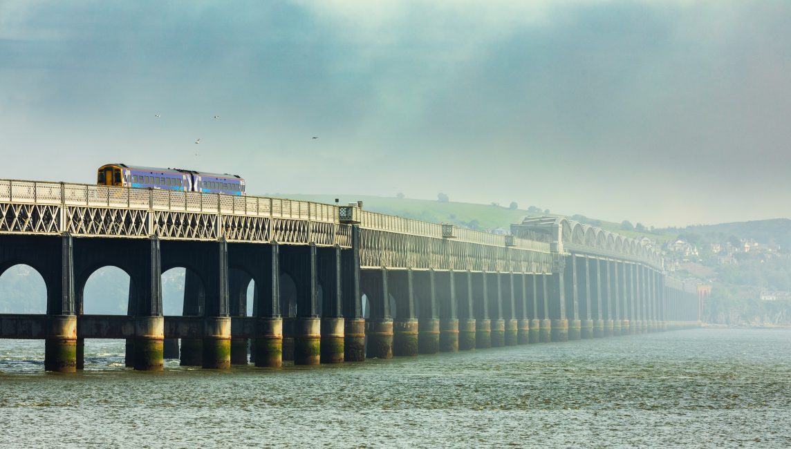 Train crossing the Tay Railway Bridge into a fog-bank, Dundee, Scotland. DD084