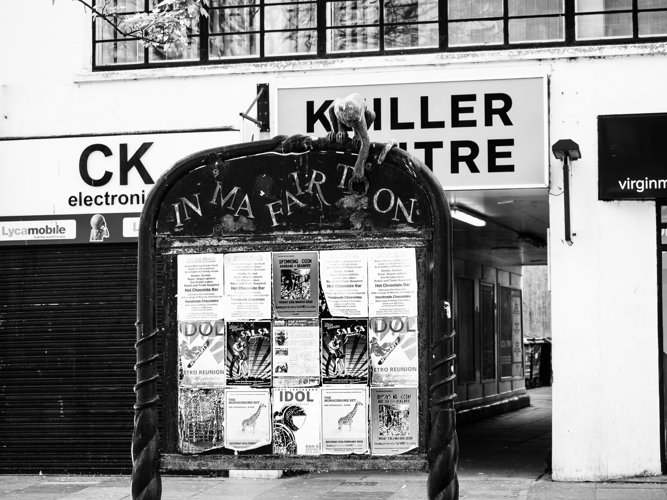 Monochrome (black and white) image of an Information board outside the Keiller Centre, Dundee, Scotland. DD060