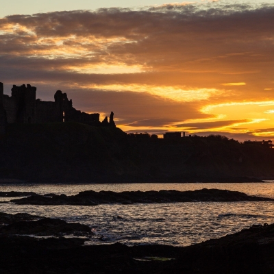 Tantallon Castle silhouetted against the sunset from Seacliff, East Lothian, Scotland. LN003 Tantallon Castle silhouetted against the sunset from Seacliff, East Lothian, Scotland.