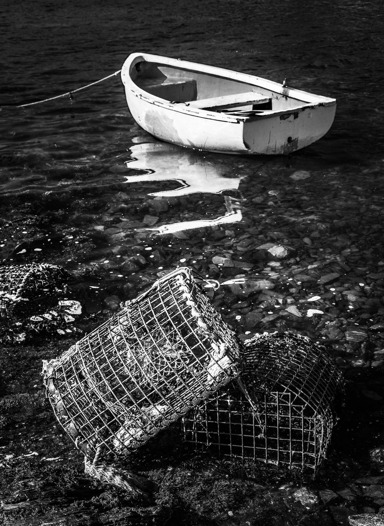 Moored boat and lobster pots, Connemara, Ireland.
