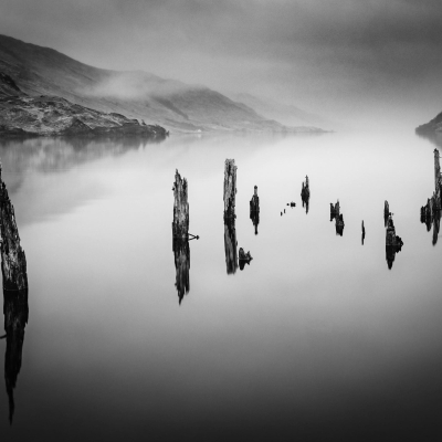 Old pier supports at the head of Loch Arkaig, Lochaber, Scotland.