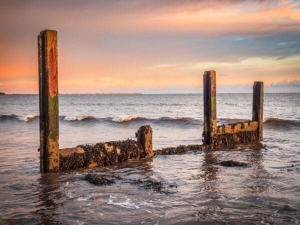 The remains of a concrete groyne on Broughty Ferry beach, Dundee, Scotland. DD175