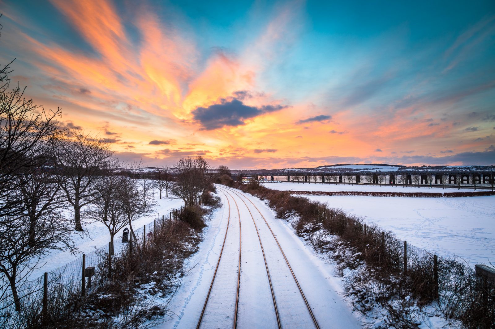 Winter sunrise over the Dundee to Perth railway line, Dundee, Scotland.  DD134