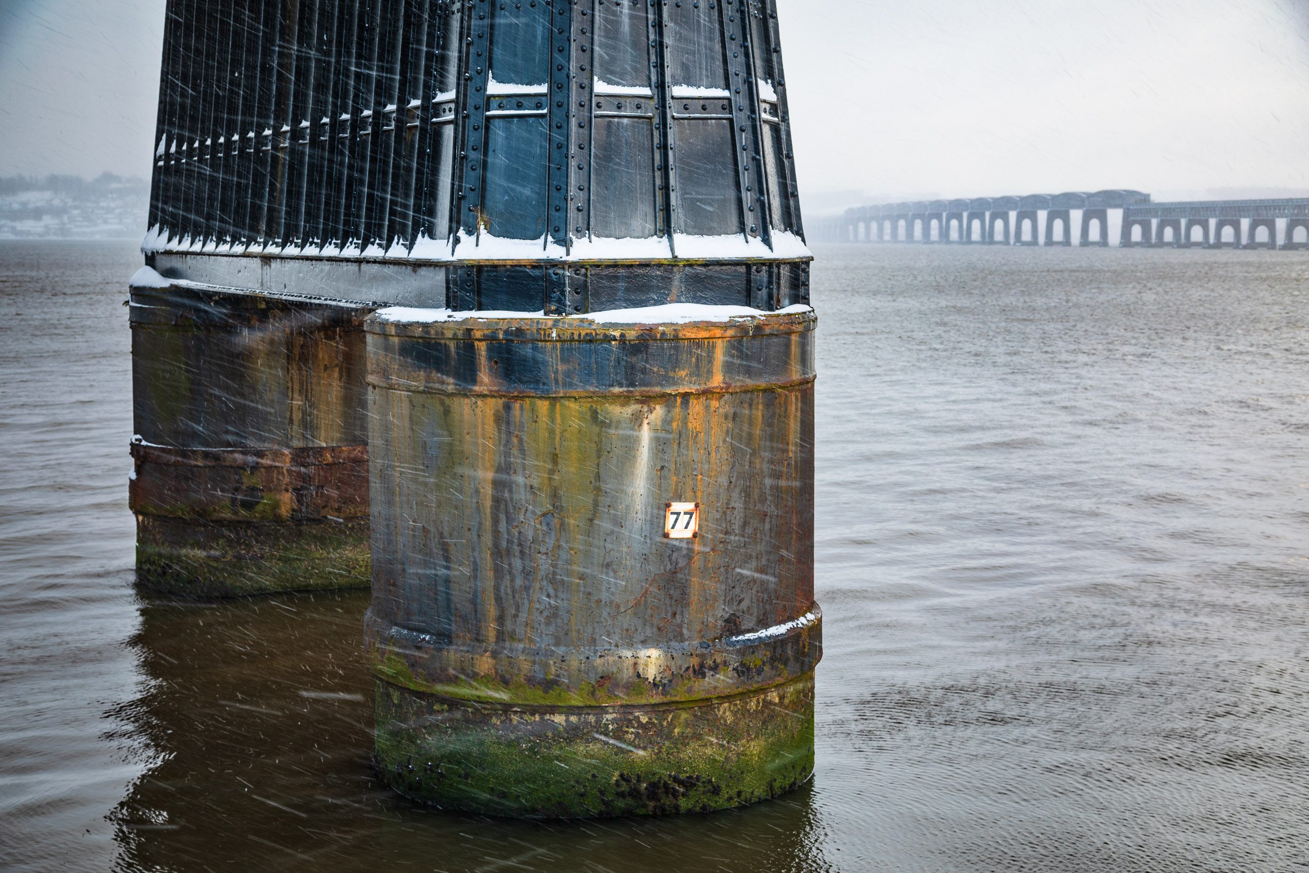 Pier of the Tay Rail Bridge in a snowstorm, Dundee, Scotland. DD116
