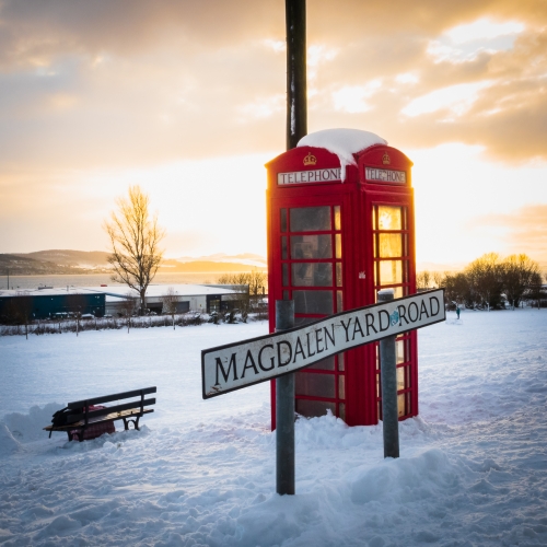 A backlit phone box on Magdalen Yard Road, Dundee, Scotland. DD122