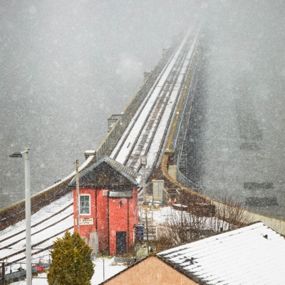 The south end of the Tay Rail Bridge disappearing into a snowstorm, Wormit, Fife, Scotland.
