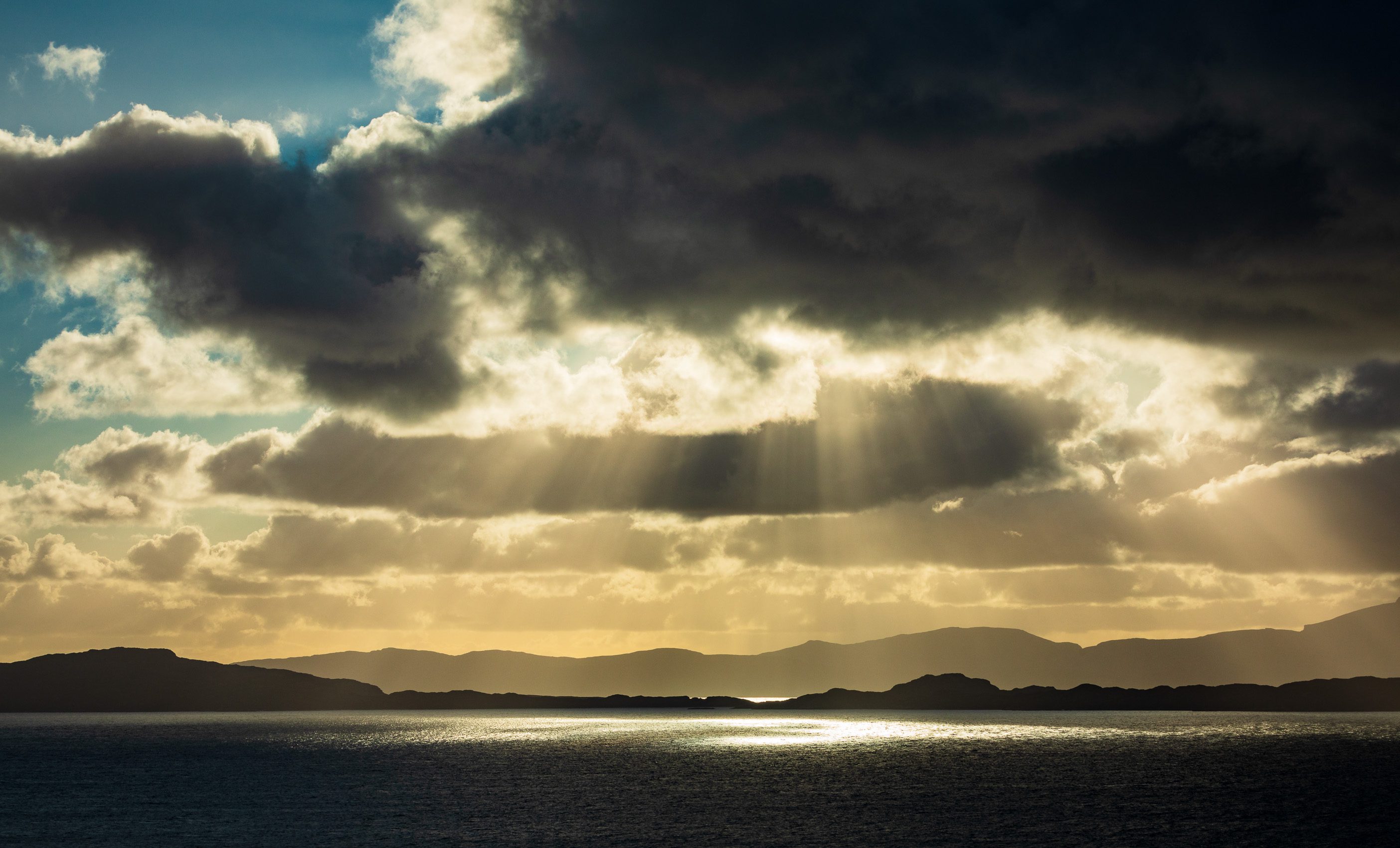 Crepuscular rays over Raasay, Skye and Rona from Applecross, Scotland. AP033