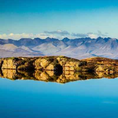 The Cuillins of Skye viewed from a lochan near the Bealach na Ba, Applecross, Scotland. AP014 The Cuillins of Skye viewed from a lochan near the Bealach na Ba, Applecross, Scotland. AP014