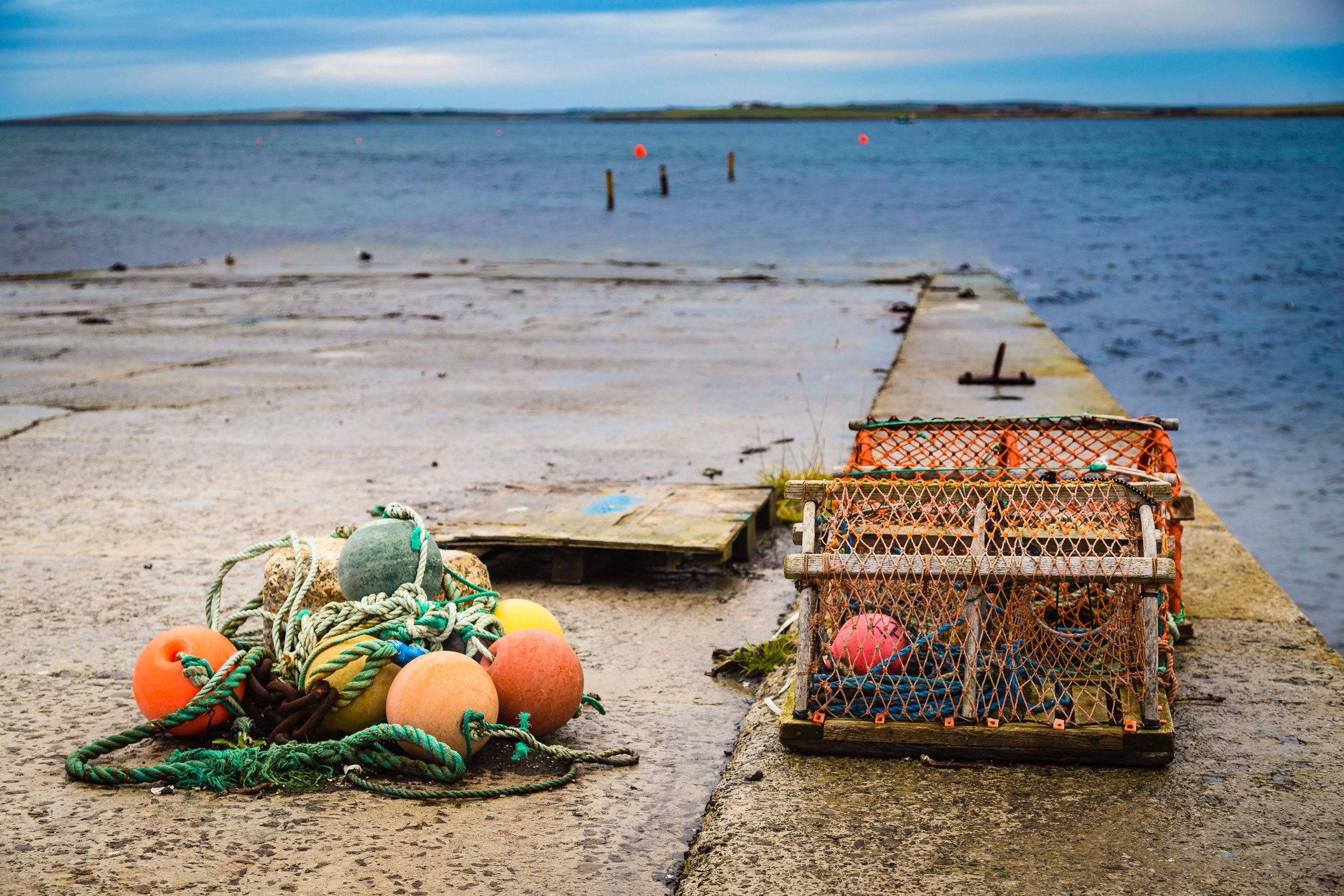 Lobster creels and buoys on a slipway in Kirkwall, Orkney Islands. OR029