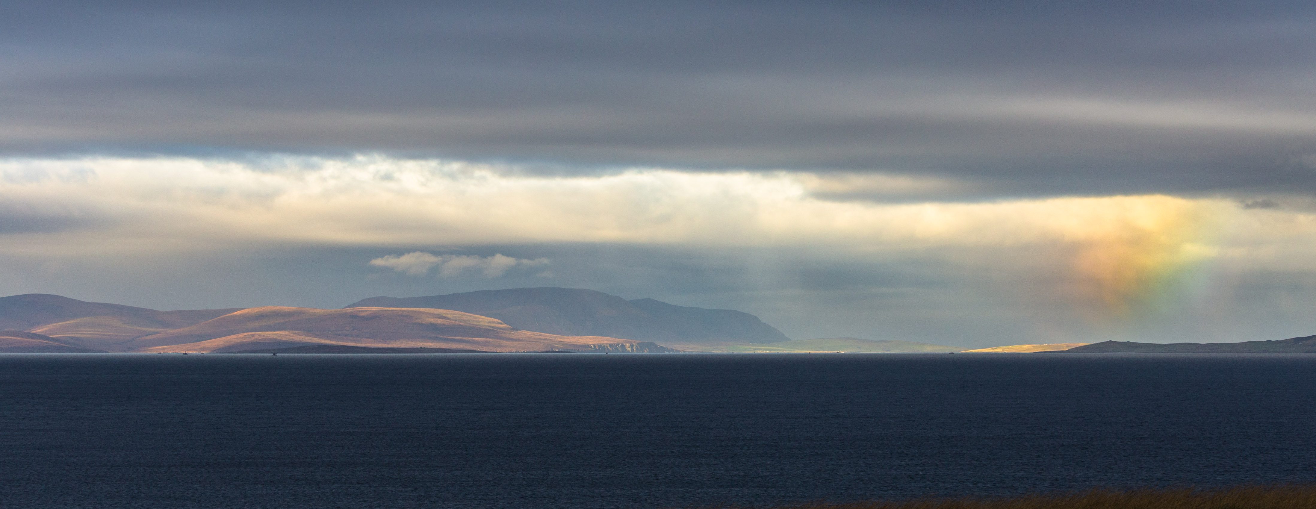 Dramatic weather over Scapa Flow and the island of Hoy, Orkney Islands. OR030
