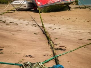 Boats beached at Youghal Harbour, County Cork, Ireland. BW003