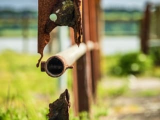 Broken metal barrier at Ballynaclash Quay on the River Blackwater, County Waterford, Ireland. BW008