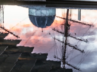 Reflections of the RRS Discovery, Discovery Centre and V&amp;A Dundee in pool outside the V&amp;A Dundee building.
