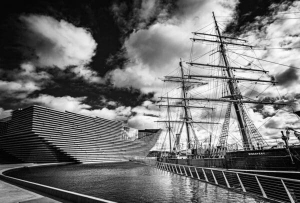 Monochrome (black and white) image of RRS Discovery and the V&amp;A Dundee, Dundee, Scotland. DD023